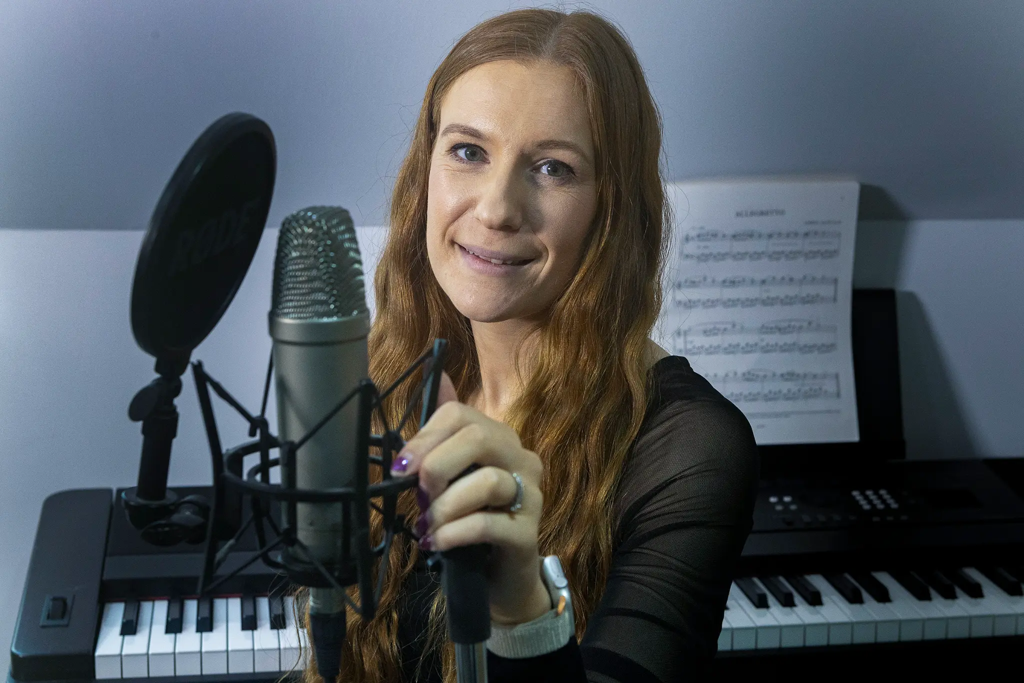 Adele Henderson at the microphone — the first featured artist on AON: THE GATHERING